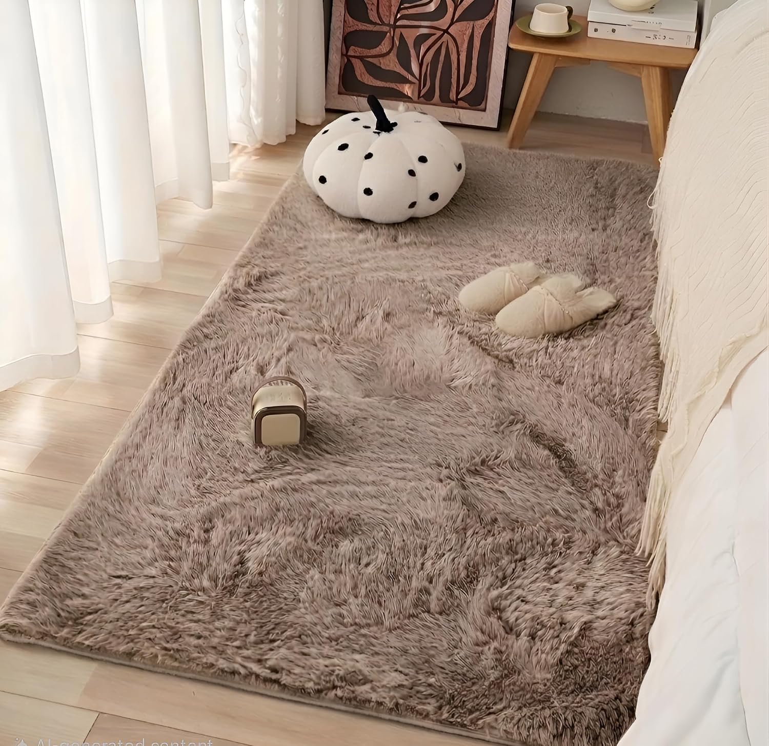 Soft faux rabbit fur carpet placed beside bed in cozy bedroom by Prisha Cart